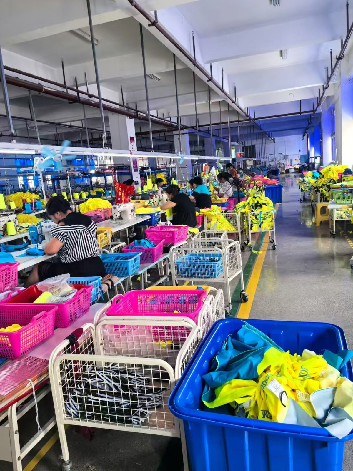 Sunwardwear sewing workshop floor with rows of production stations